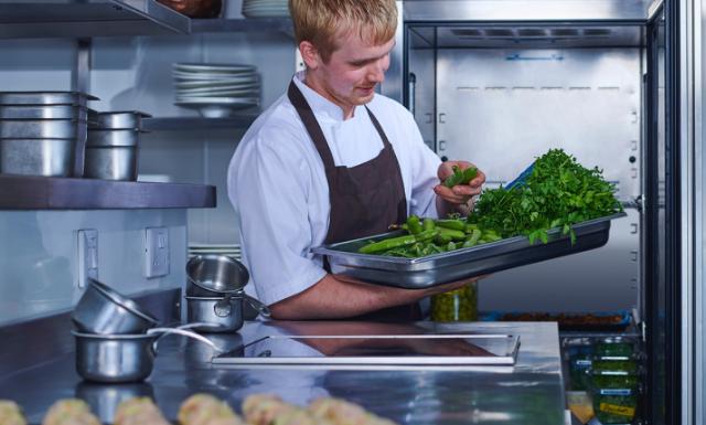 chef selecting vegetables in kitchen environment 